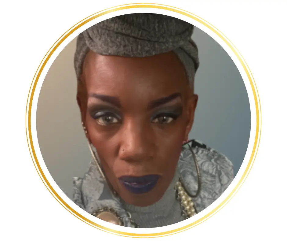 african american woman with head wrap and large earrings closeup